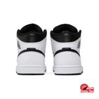 this is an image of Jordan 1 Mid "Reverse Panda" GS