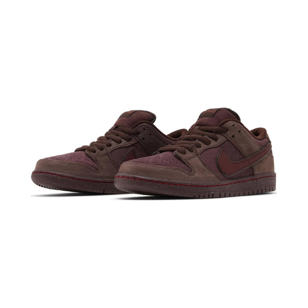 Nike Dunk Low Retro Premium Burgundy Crush lateral view showing deep wine-toned suede upper and white foam midsole