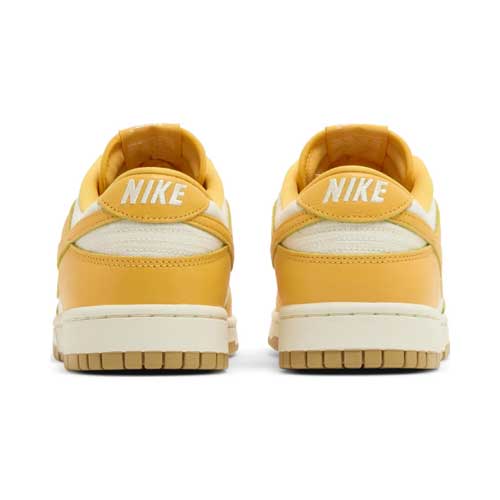 this is an image of Nike Dunk Low "Peach Cream" (Women's)