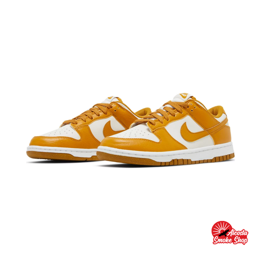 this is an image of Nike Dunk Low "Phantom Gold Suede" (Women's)