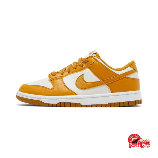 this is an image of Nike Dunk Low "Phantom Gold Suede" (Women's)